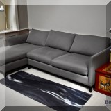 F51. Gray Crate & Barrel sectional. 32” h x 102”w x 64”d 